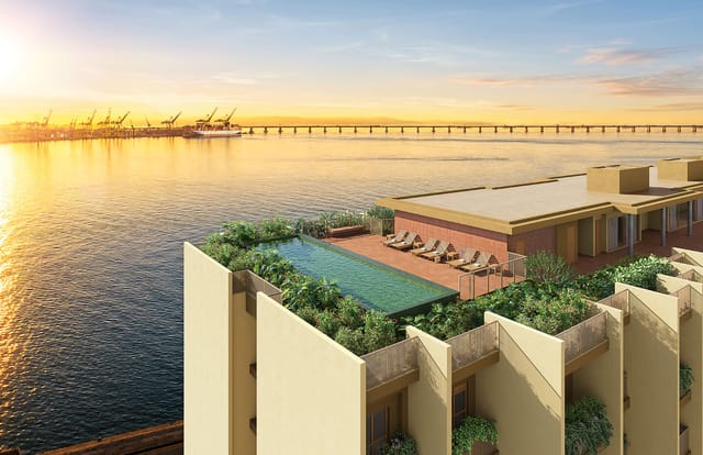 Piscina do rooftop com a Baía de Guanabara e a ponte ao fundo do Erê Residencial, no Santo Cristo