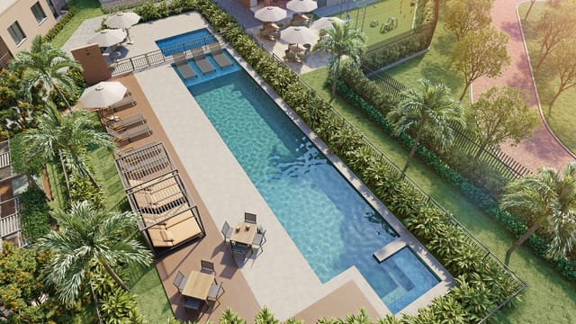 Perspectiva aérea da piscina com raia, solário e espreguiçadeiras do Residencial Dona Ivone Lara, no Santo Cristo